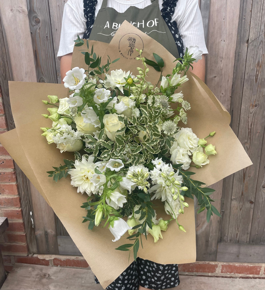 Classic white and green flowers in a hand-tied bouquet